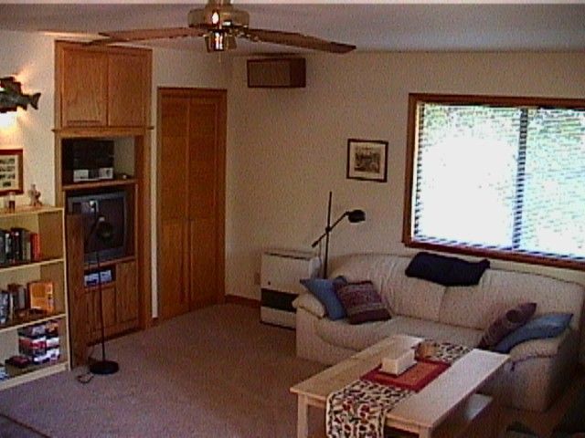 A living room with a couch and table